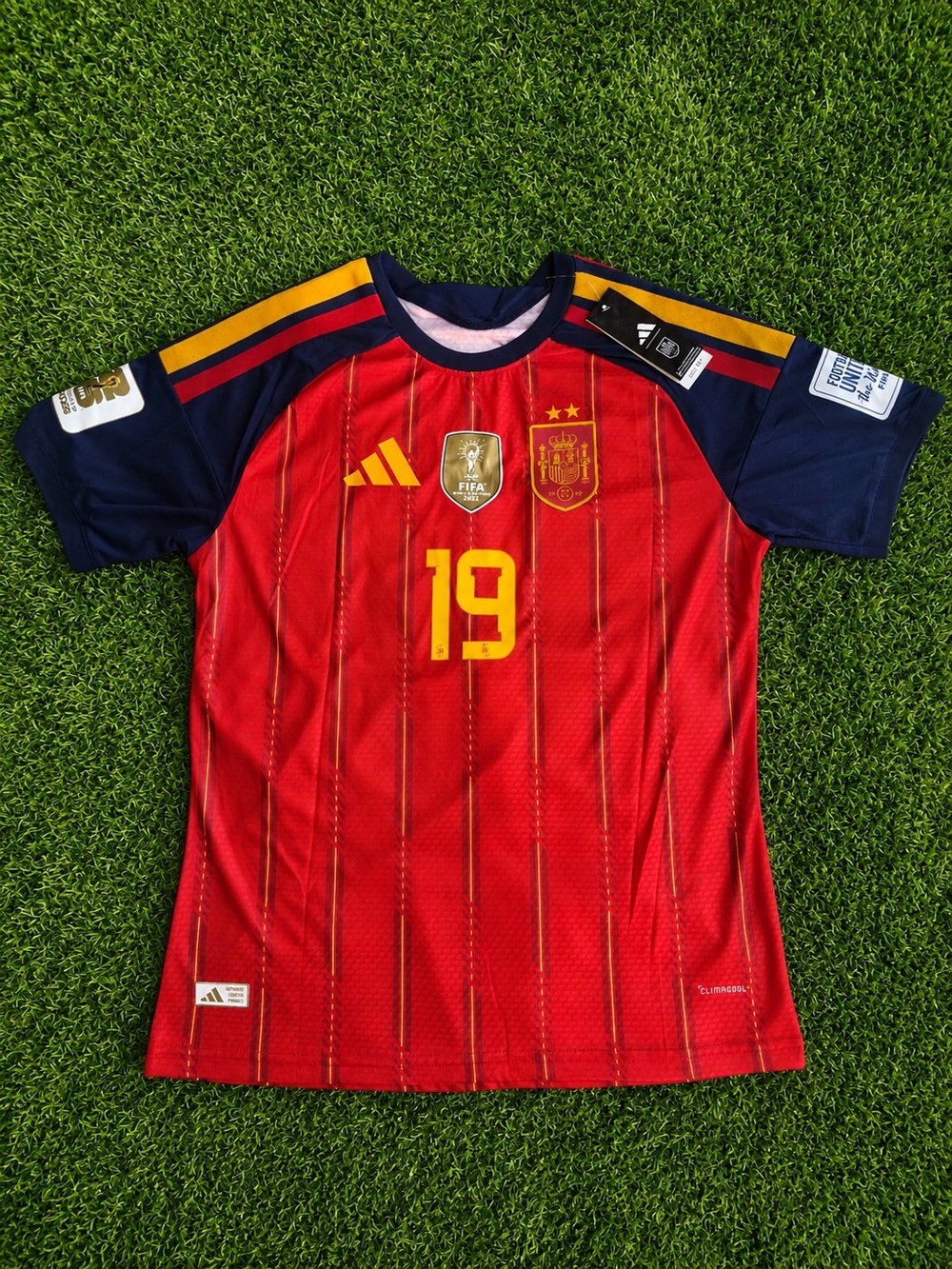 adidas Kids Spain Red Soccer Jersey with Navy Sleeves and Yellow Accents